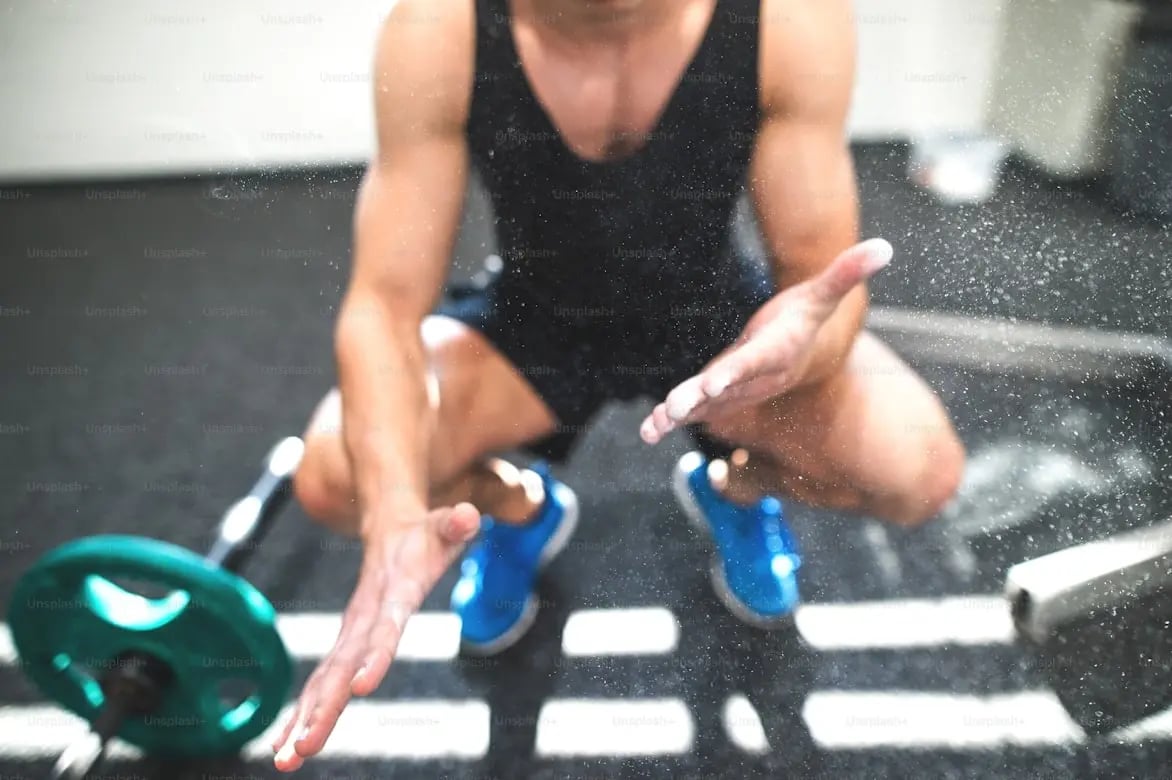 A young man in a squat position