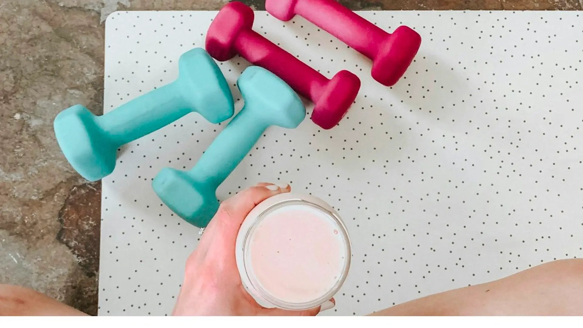 a person holding a cup of fruit shake